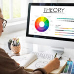 Woman working on color theory with a computer.