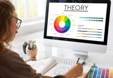 Woman working on color theory with a computer.